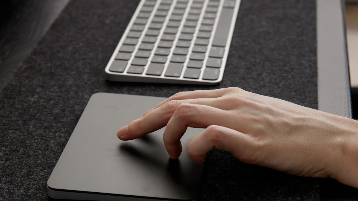 Trackball vs Vertical Mouse for Wrist Pain 1 Close-up of a hand resting on a mouse pad next to a keyboard, the kind of setup where wrist position during mousing matters most