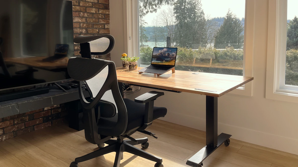 Home office desk with a laptop in front of a window, a typical workspace where the choice between a desk converter and a standing desk comes up