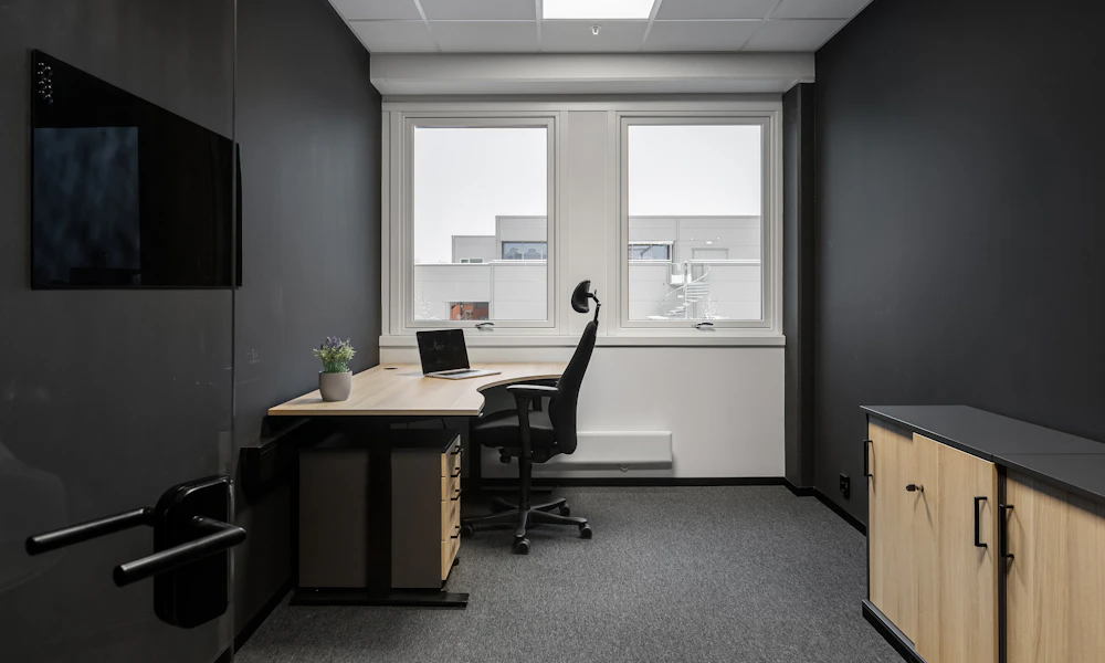Empty minimalist office with a desk and chairs