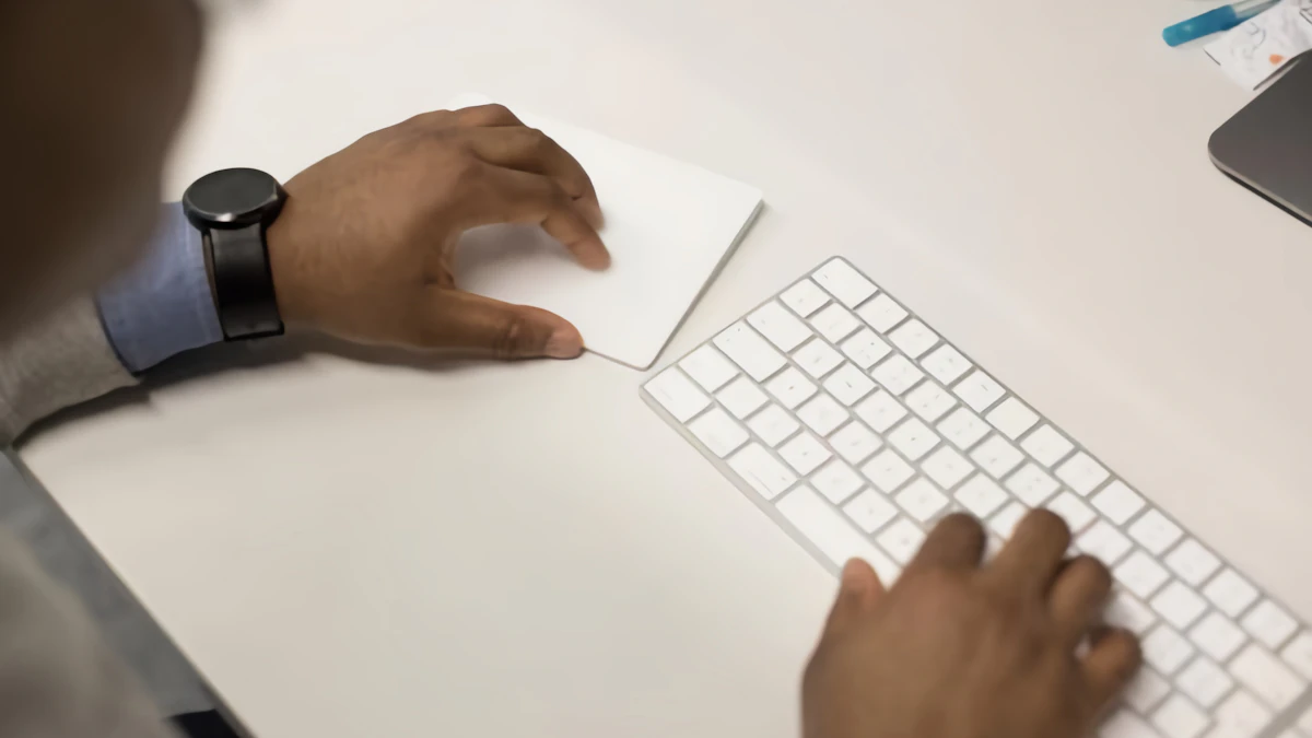 Close-up of hands typing on a keyboard, the kind of daily use that determines how fast someone adjusts to an ergonomic layout