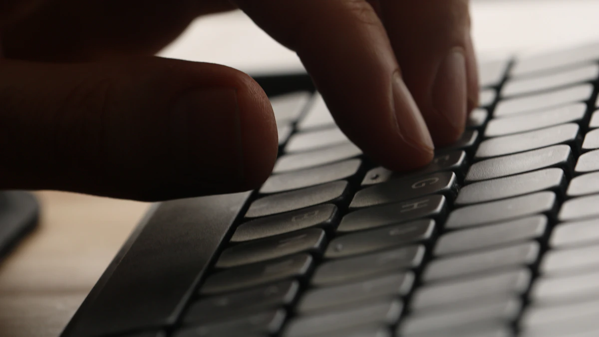 Does an Ergonomic Keyboard Slow Down Your Typing Speed? 1 Close-up of a hand typing on a keyboard, illustrating the muscle memory involved in typing speed