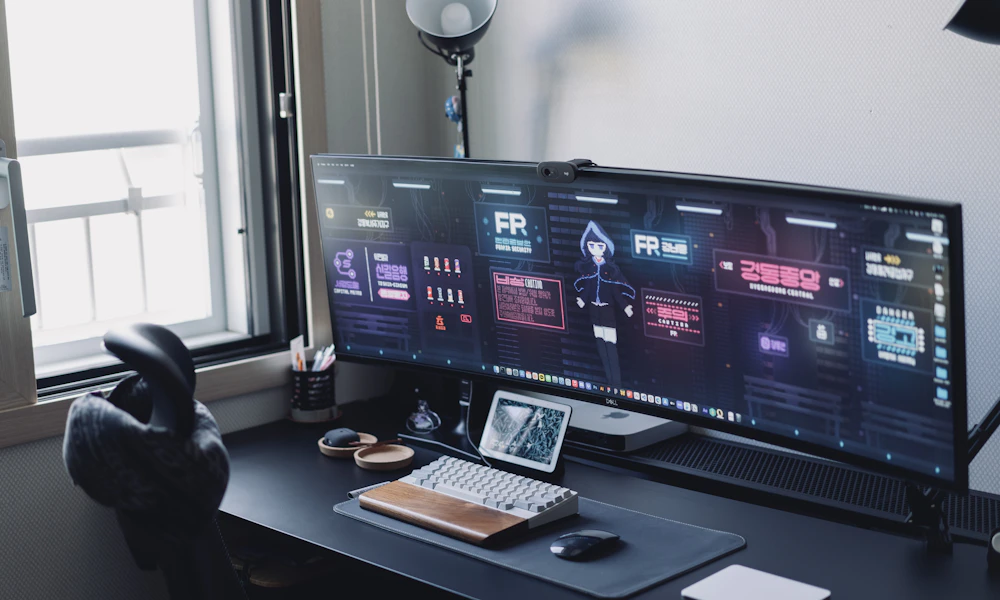 Gas Spring vs Mechanical Monitor Arm: Which Should You Buy? 2 Minimalist desk setup with a single monitor, the kind of lighter, set-once display suited to a mechanical monitor arm