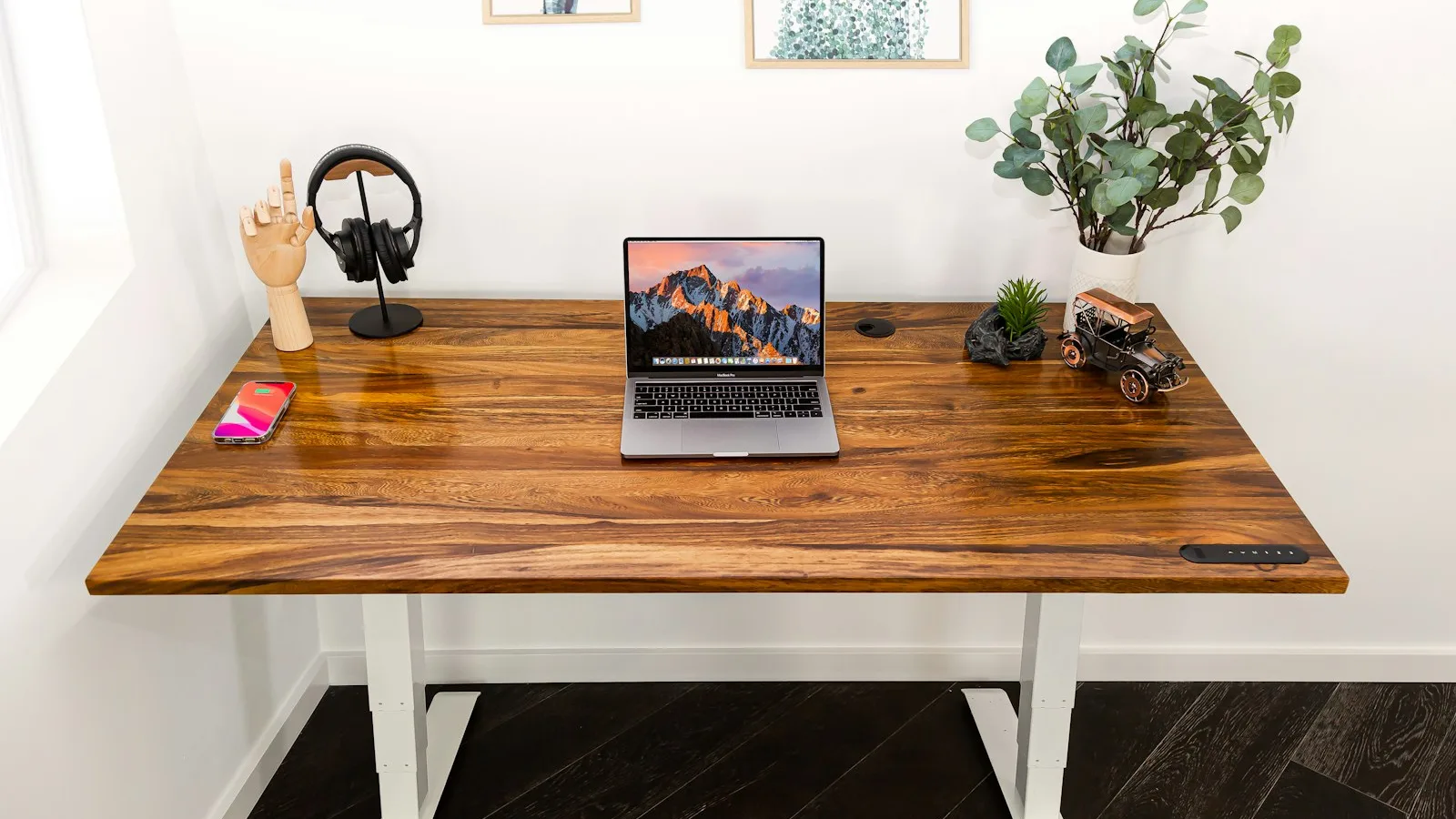 Signs Your Standing Desk Motor Is Failing 1 Electric standing desk with wooden top and visible control panel on the edge of the desk